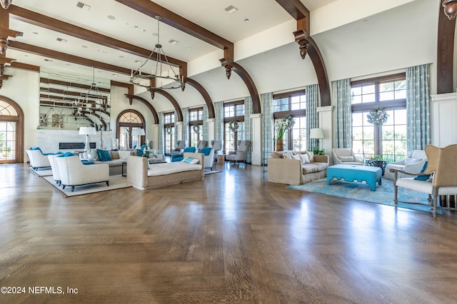 interior space with beamed ceiling and parquet flooring