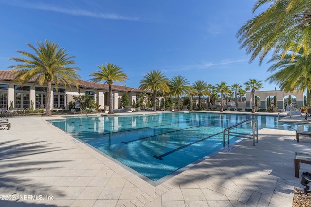 view of swimming pool with a patio