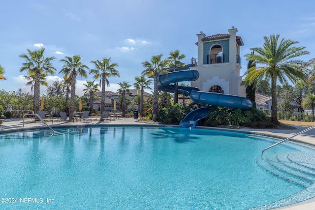 view of pool with a water slide