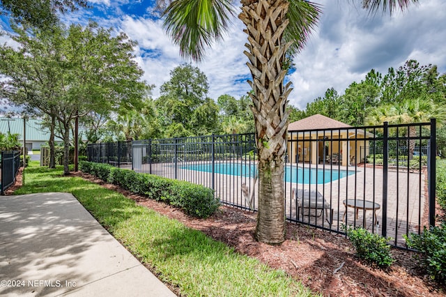 view of swimming pool featuring a patio