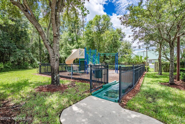 surrounding community with a playground and a yard