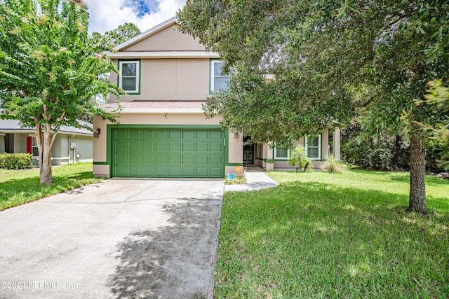 view of front of property with a garage and a front lawn