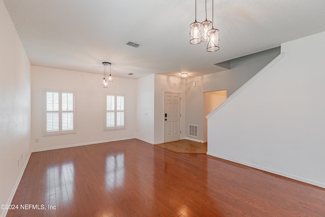 interior space featuring a chandelier and hardwood / wood-style floors