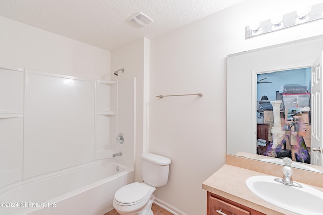 full bathroom featuring shower / bathtub combination, a textured ceiling, toilet, tile patterned flooring, and vanity