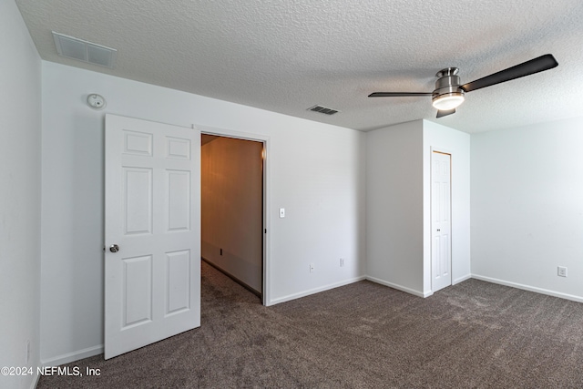 unfurnished bedroom with carpet floors, visible vents, and baseboards