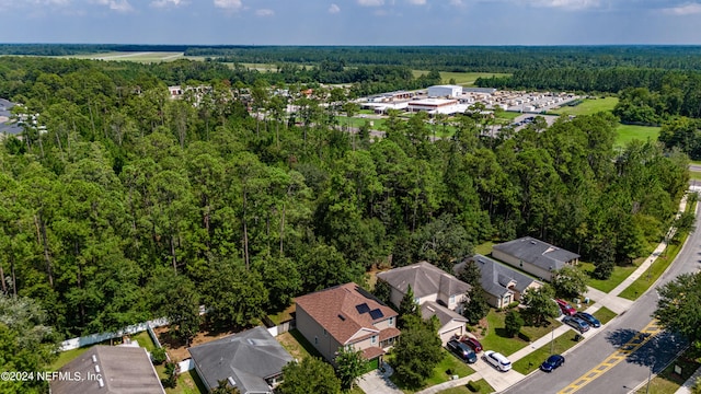 aerial view featuring a wooded view