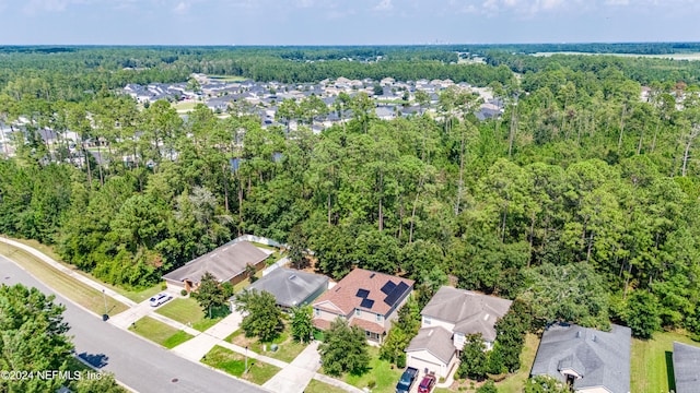 aerial view with a wooded view and a residential view