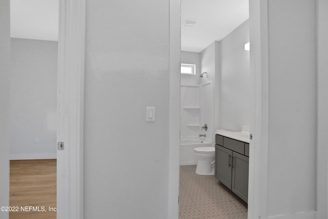 full bathroom featuring shower / bathtub combination, toilet, and vanity