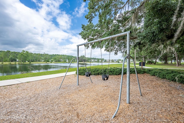 view of playground with a water view