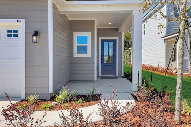 property entrance featuring a garage