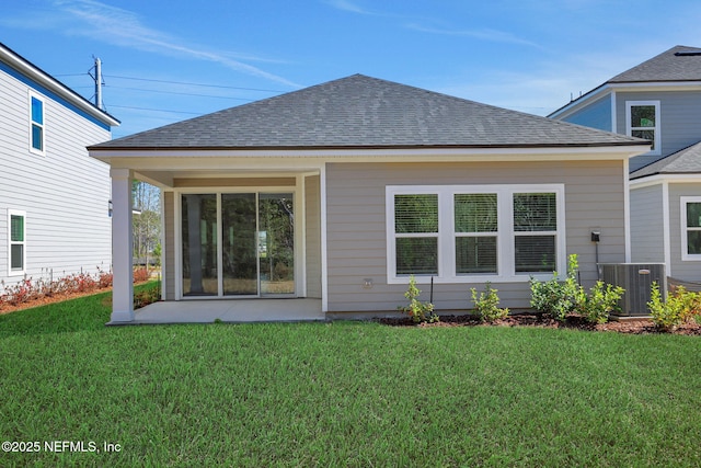 back of house with a patio, central AC, and a lawn