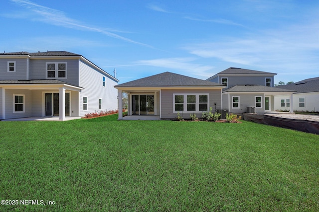 back of house with a yard, central AC, and a patio area