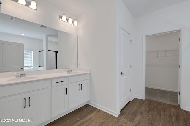 bathroom with vanity and hardwood / wood-style floors