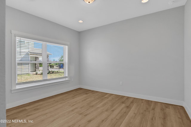 unfurnished room featuring light hardwood / wood-style floors