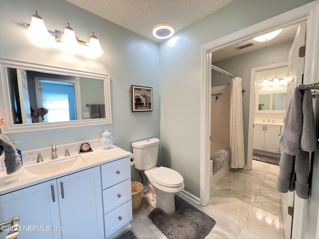 bathroom with visible vents, toilet, shower / bath combo with shower curtain, a textured ceiling, and vanity