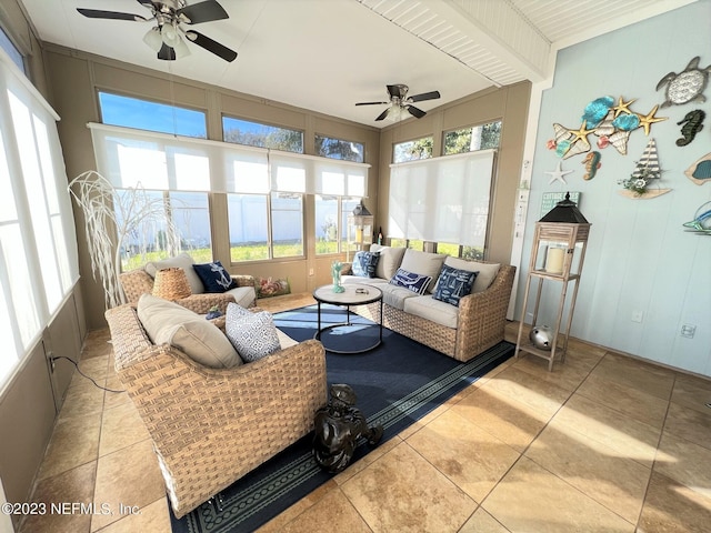 sunroom / solarium featuring a ceiling fan and a healthy amount of sunlight