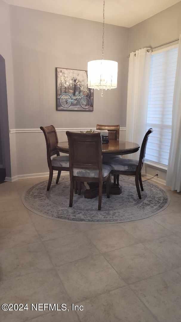 dining room featuring baseboards