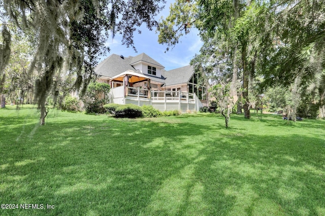 view of yard with a gazebo and a deck