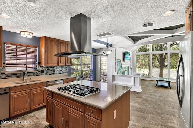 kitchen with sink, a center island, hanging light fixtures, stainless steel appliances, and island range hood