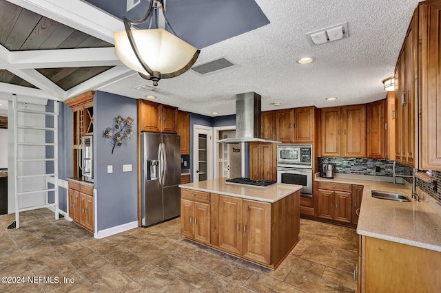 kitchen with island exhaust hood, decorative backsplash, stainless steel appliances, a center island, and hanging light fixtures