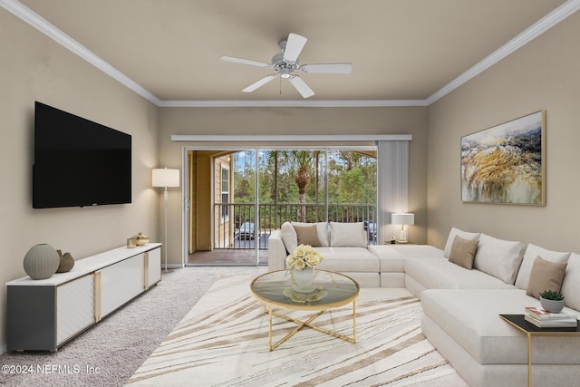 living room with ceiling fan, light colored carpet, and ornamental molding