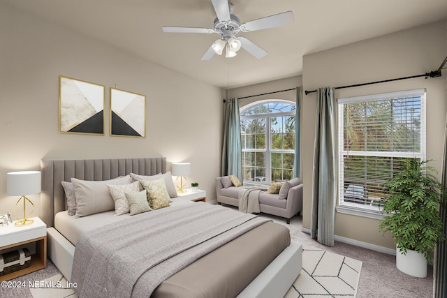 bedroom with light colored carpet and ceiling fan