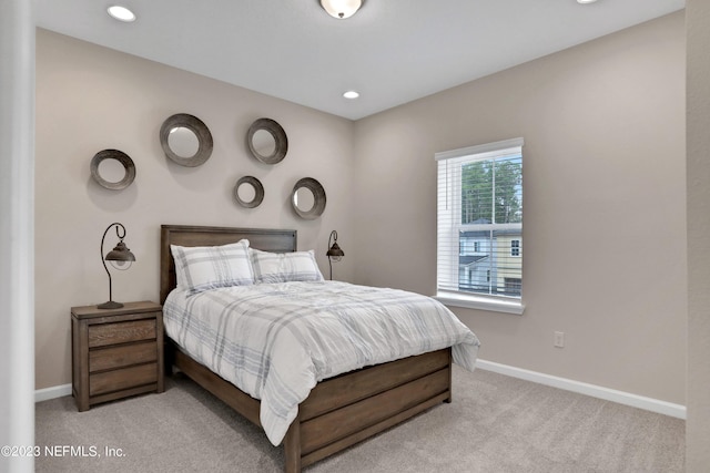 bedroom with light colored carpet