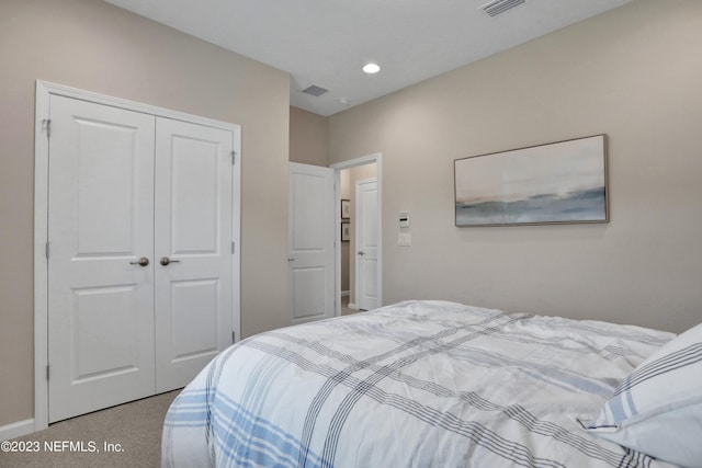 bedroom featuring a closet and carpet flooring