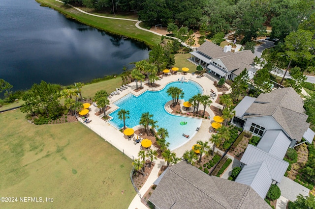 birds eye view of property with a water view