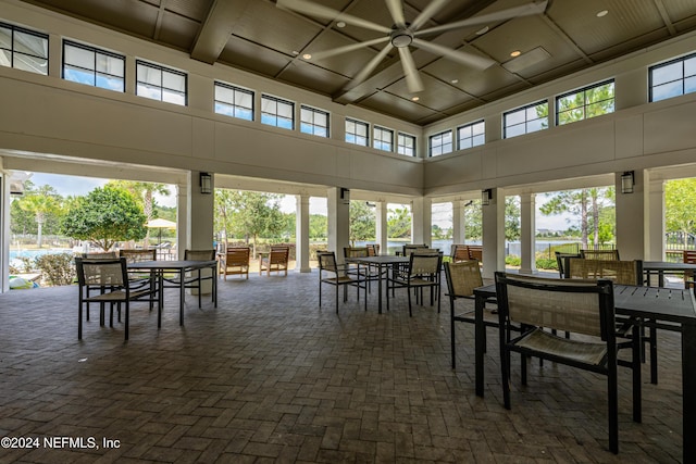 sunroom featuring beamed ceiling and coffered ceiling