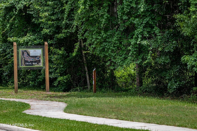 view of home's community featuring a lawn