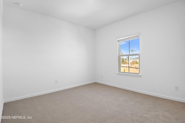 unfurnished room with carpet floors