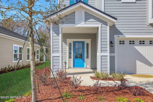 property entrance with a garage