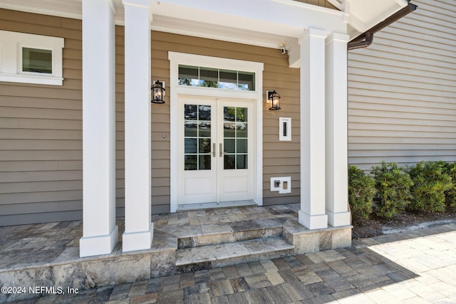 view of exterior entry featuring french doors