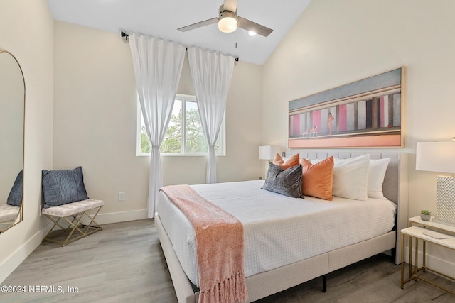 bedroom featuring lofted ceiling, wood-type flooring, and ceiling fan