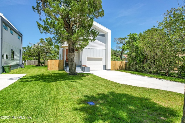 exterior space with a front lawn and a garage