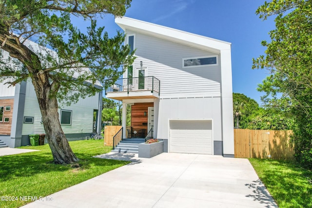 modern home with a front yard and a garage