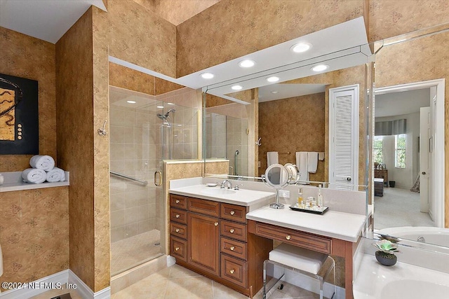 bathroom featuring tile patterned floors, vanity, and plus walk in shower