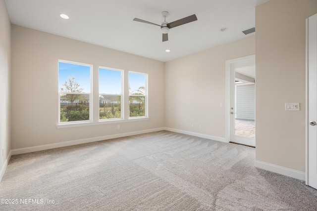 unfurnished room featuring visible vents, baseboards, a ceiling fan, carpet, and recessed lighting