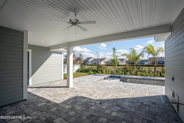 view of patio featuring ceiling fan