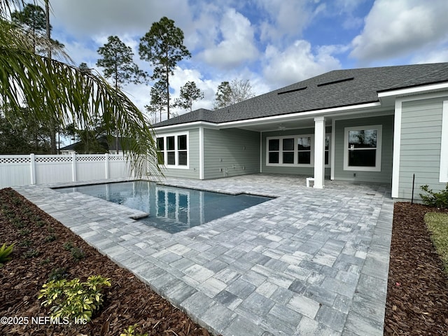 view of swimming pool with a fenced in pool, a fenced backyard, and a patio