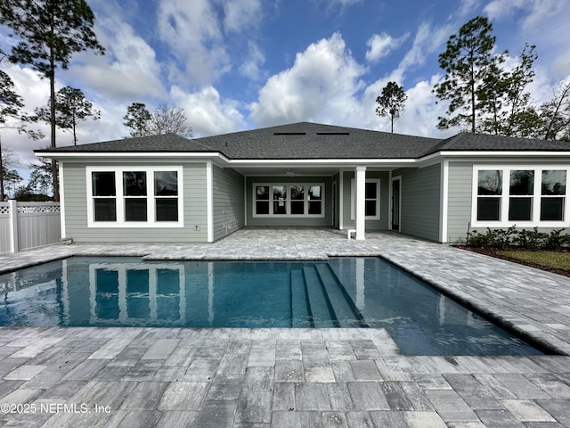 pool with fence and a patio