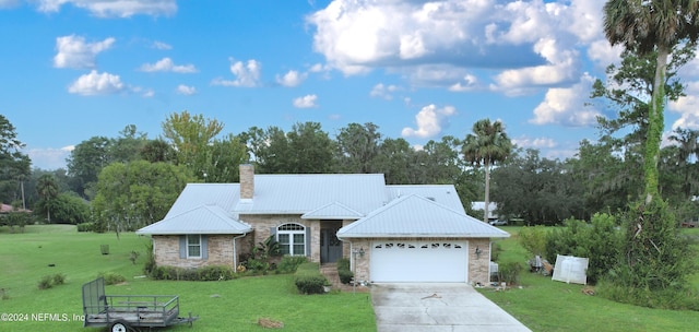 ranch-style home with a garage and a front lawn