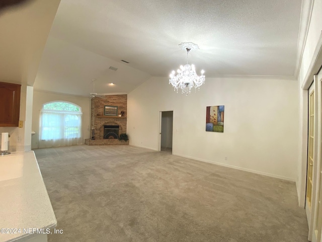 unfurnished living room featuring a fireplace, lofted ceiling, light carpet, a chandelier, and baseboards