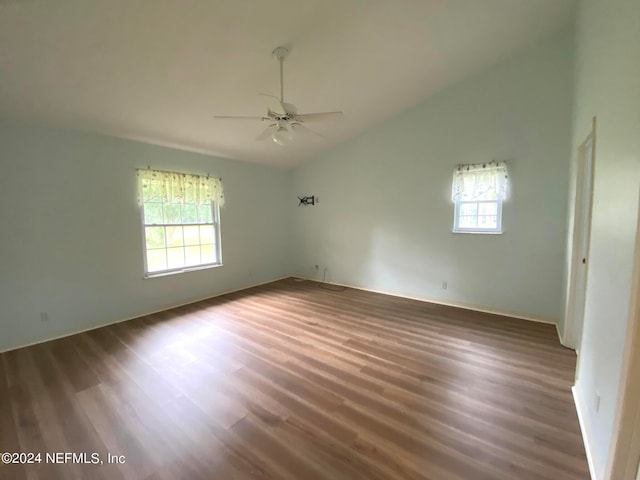 spare room featuring hardwood / wood-style floors, ceiling fan, and lofted ceiling