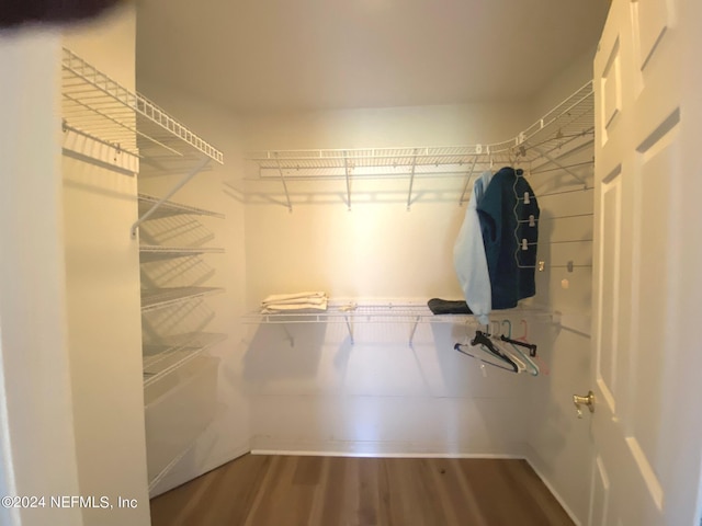 spacious closet with wood finished floors