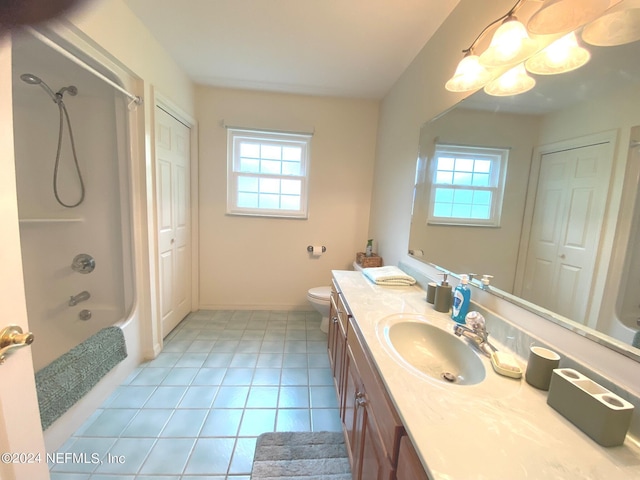 full bath featuring tile patterned flooring, shower / tub combination, vanity, and toilet