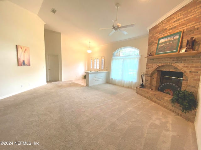 unfurnished living room featuring light colored carpet, a brick fireplace, ceiling fan, and ornamental molding