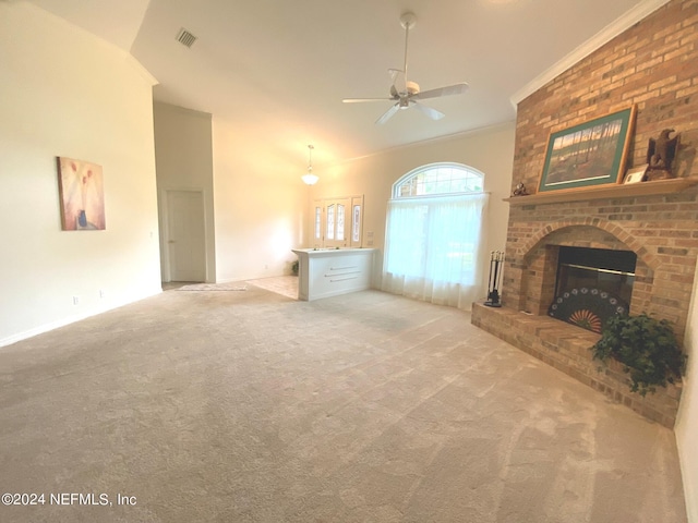 unfurnished living room featuring visible vents, a ceiling fan, ornamental molding, carpet flooring, and a brick fireplace