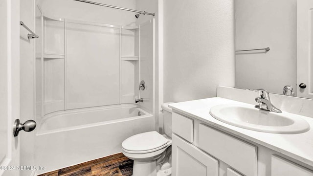 full bathroom with shower / tub combination, vanity, hardwood / wood-style flooring, and toilet